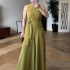 Sleeveless green jumpsuit with a relaxed fit