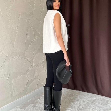 White eco-fur vest featuring ribbon closures