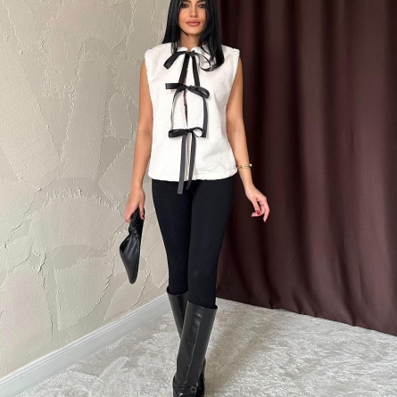 White eco-fur vest featuring ribbon closures