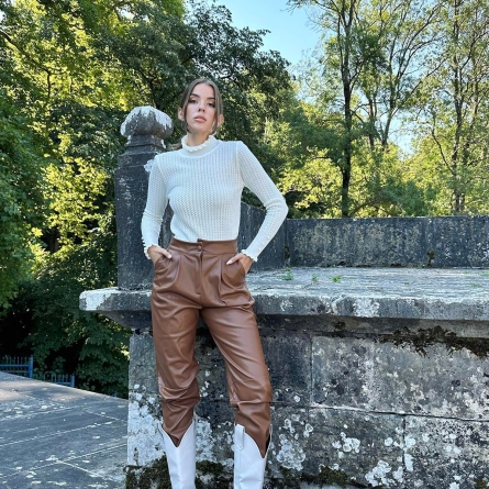 White knitted sweater with ruffles and pearl details