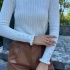 White knitted sweater with ruffles and pearl details