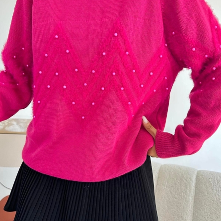Fuchsia sweater with pearls and textured pattern