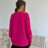 Fuchsia sweater with pearls and textured pattern