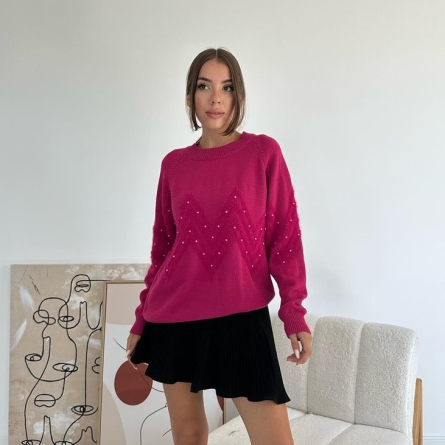 Fuchsia sweater with pearls and textured pattern