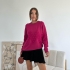 Fuchsia sweater with pearls and textured pattern